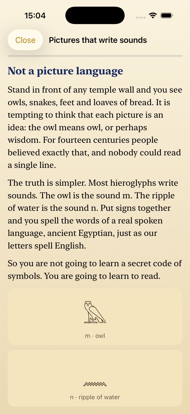 A course lesson screen with hieroglyphic sign cards and an exercise.
